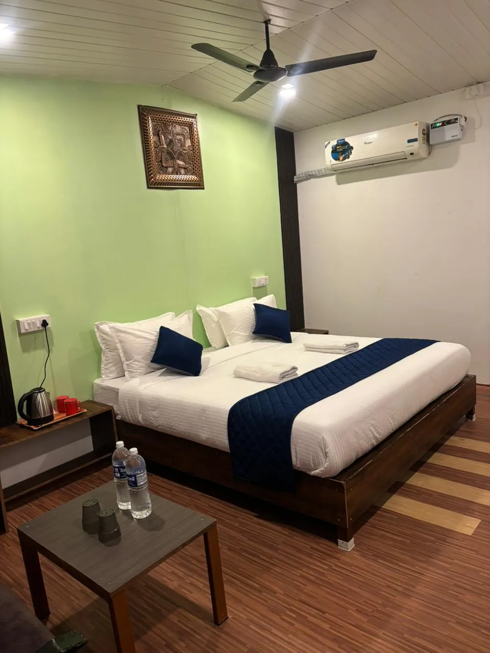 Premium AC room with navy bed runner
